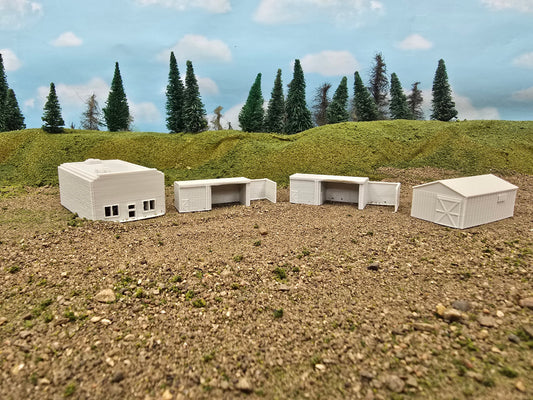 Model buildings on a landscape with trees and sky in the background