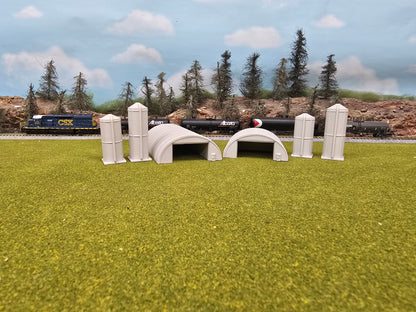 Model train set with tunnels and a forest background